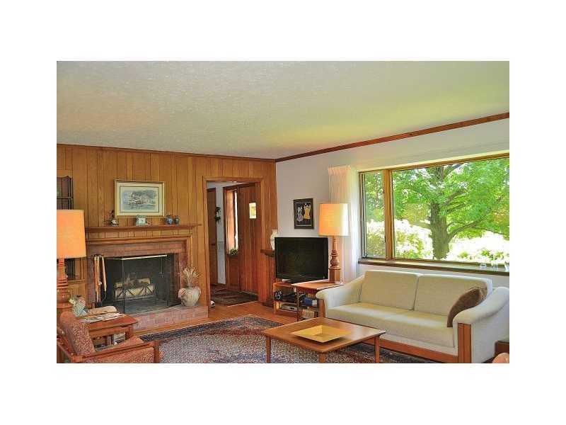 426 Sangree Road Pittsburgh, PA 15237 - Photo 6 of 25 Living Room. The log burning fireplace has gas capability. Its brick hearth matches the exterior brick and there is a built-in bookcase to the left of the fireplace. The picture window brings nature s art right into the living room!