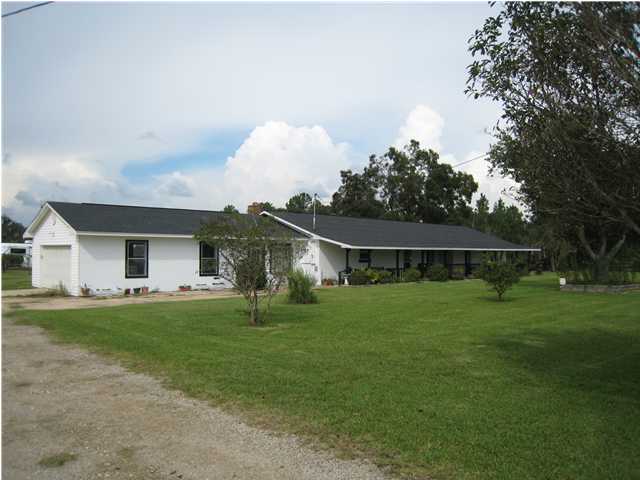 1517 Hester Church Road Baker, FL 32531 - Photo 1 of 28 a front view of house with yard barbeque and outdoor seating