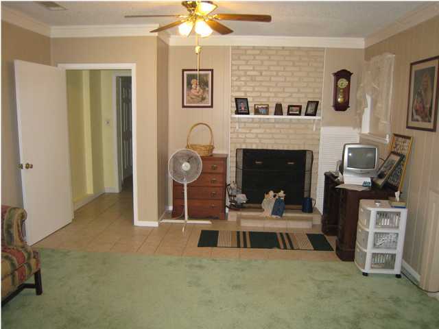 1517 Hester Church Road Baker, FL 32531 - Photo 11 of 28 a living room with furniture and a fireplace