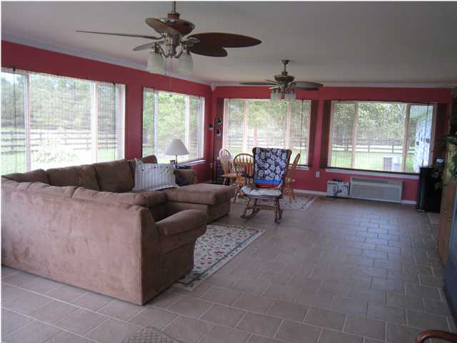 1517 Hester Church Road Baker, FL 32531 - Photo 2 of 28 a living room with furniture and a large window