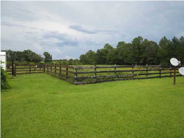 1517 Hester Church Road Baker, FL 32531 - Photo 26 of 28 a view of a golf course with a lake