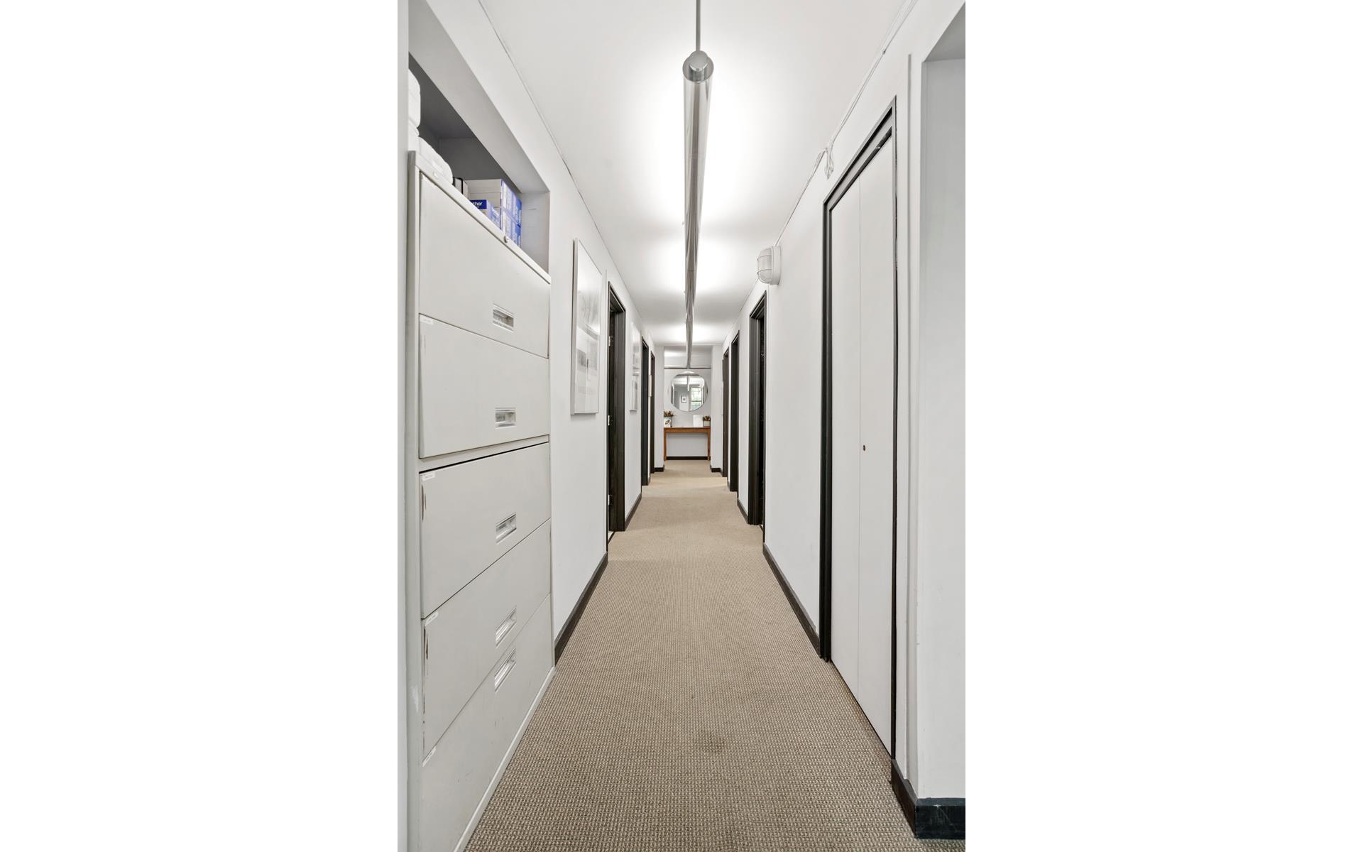 1120 Park Avenue, Unit 1C Manhattan, NY 10128 - Photo 3 of 11 a view of a hallway with white walls