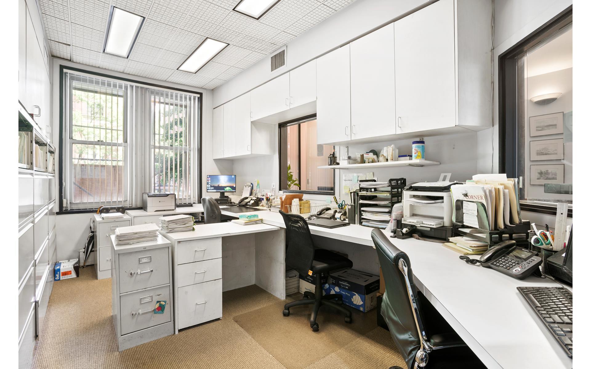 1120 Park Avenue, Unit 1C Manhattan, NY 10128 - Photo 4 of 11 a view of a kitchen with workspace and a window