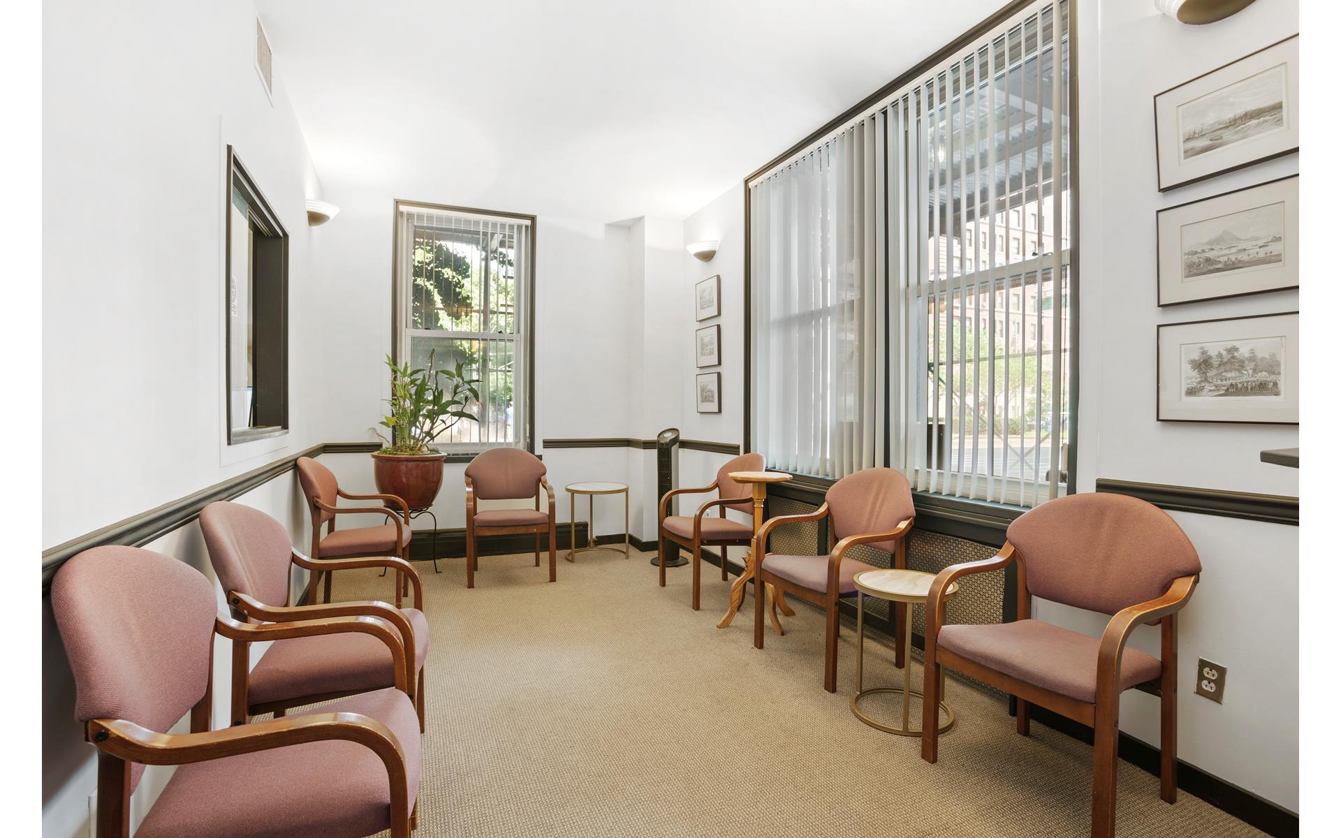 1120 Park Avenue, Unit 1C Manhattan, NY 10128 - Photo 6 of 11 a living room with furniture and a large window