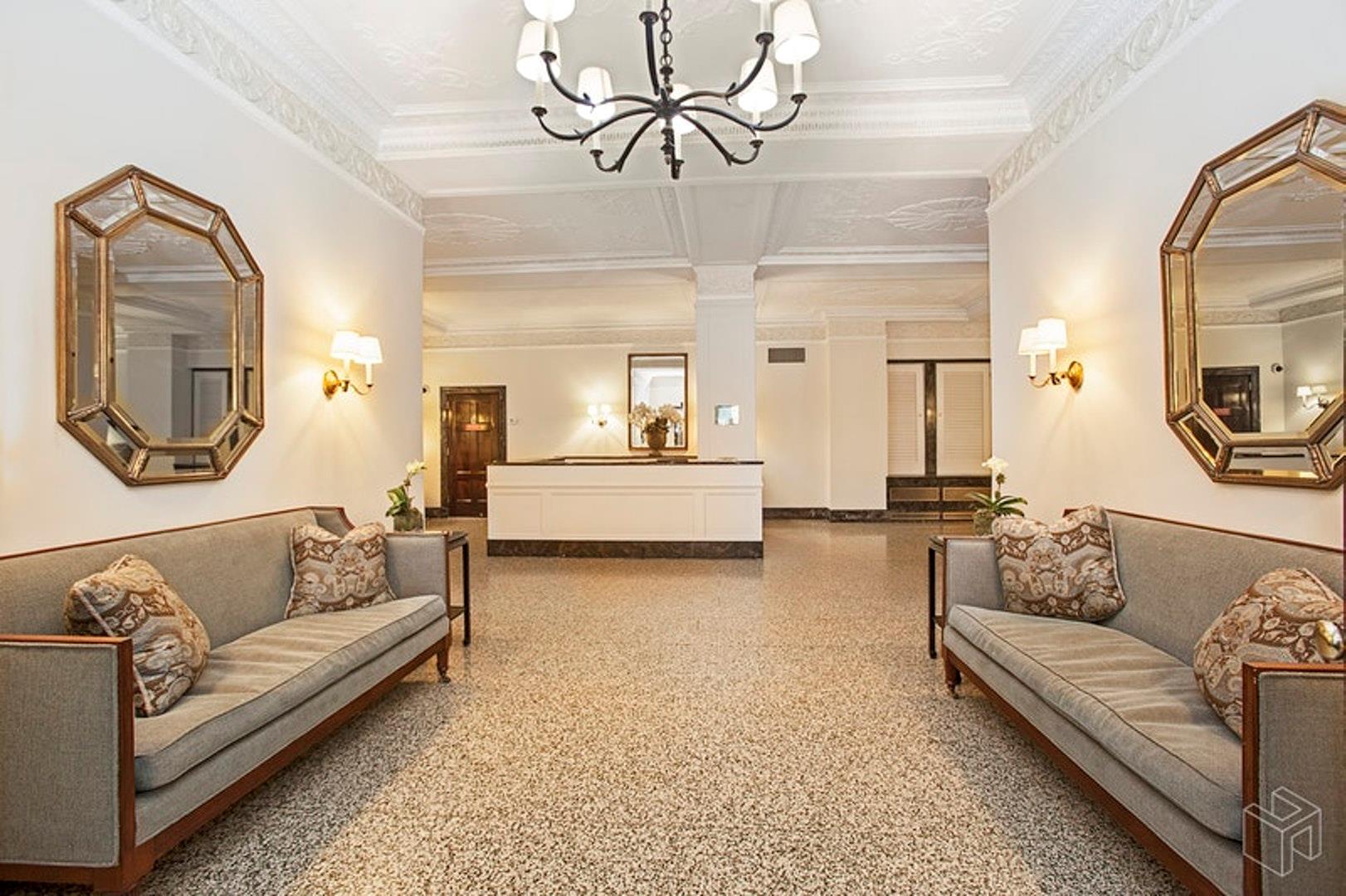 1120 Park Avenue, Unit 1C Manhattan, NY 10128 - Photo 9 of 11 a living room with furniture and a mirror