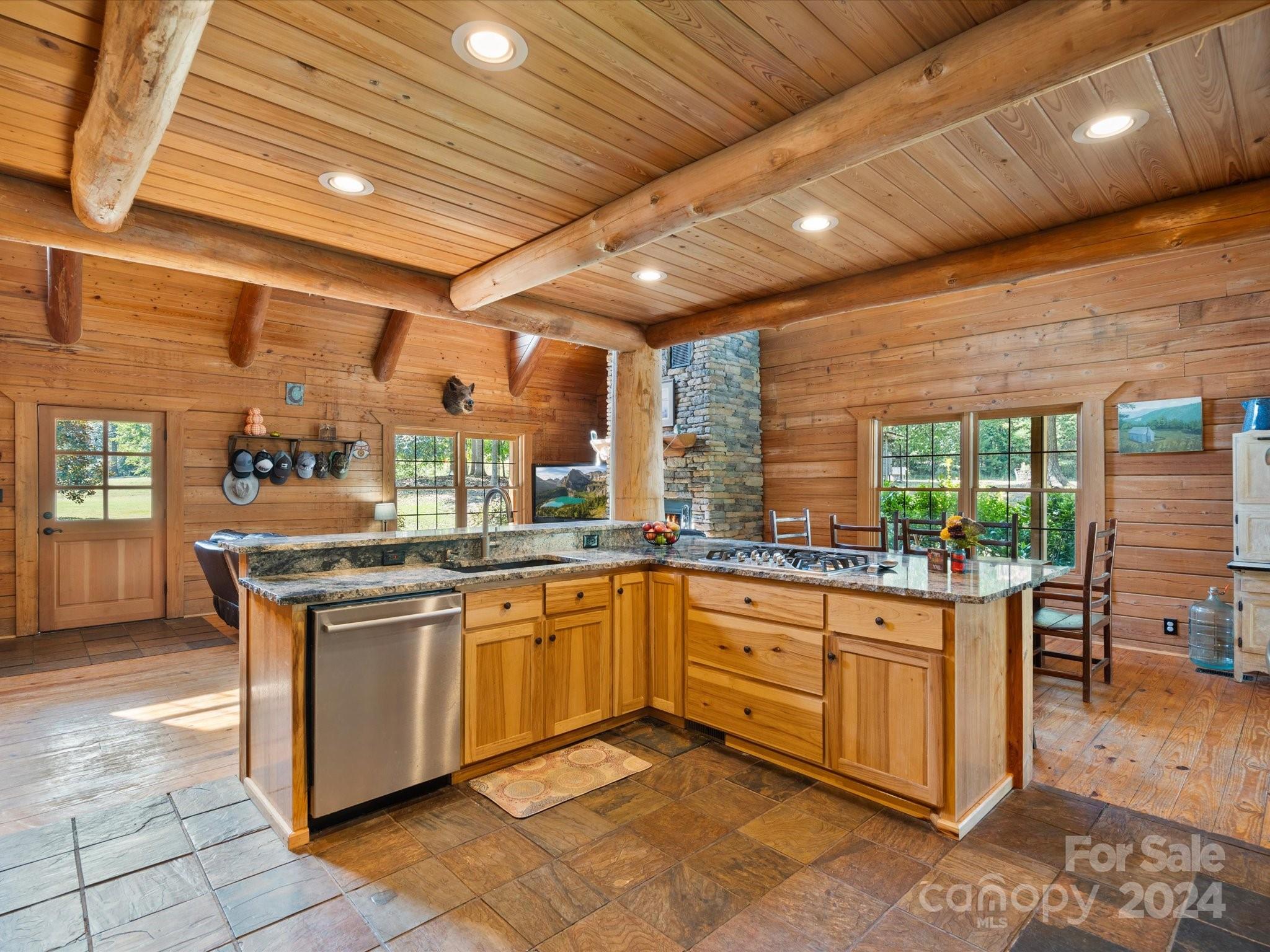 674 Ormond Road York, SC 29745 - Photo 12 of 48 a kitchen with stainless steel appliances granite countertop sink stove and cabinets