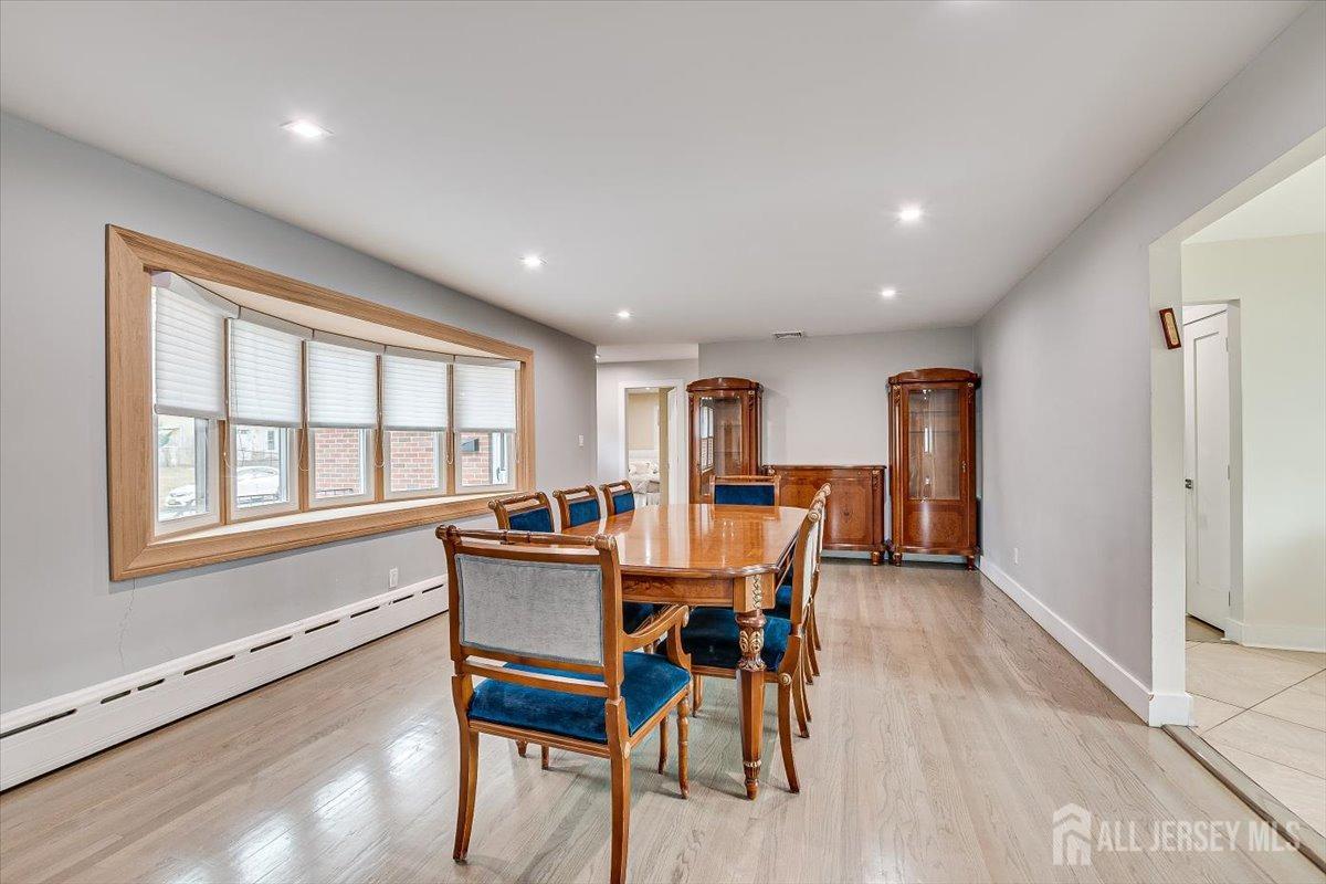 28 Clark Avenue Edison, NJ 08817 - Photo 11 of 47 a dining room with furniture and window