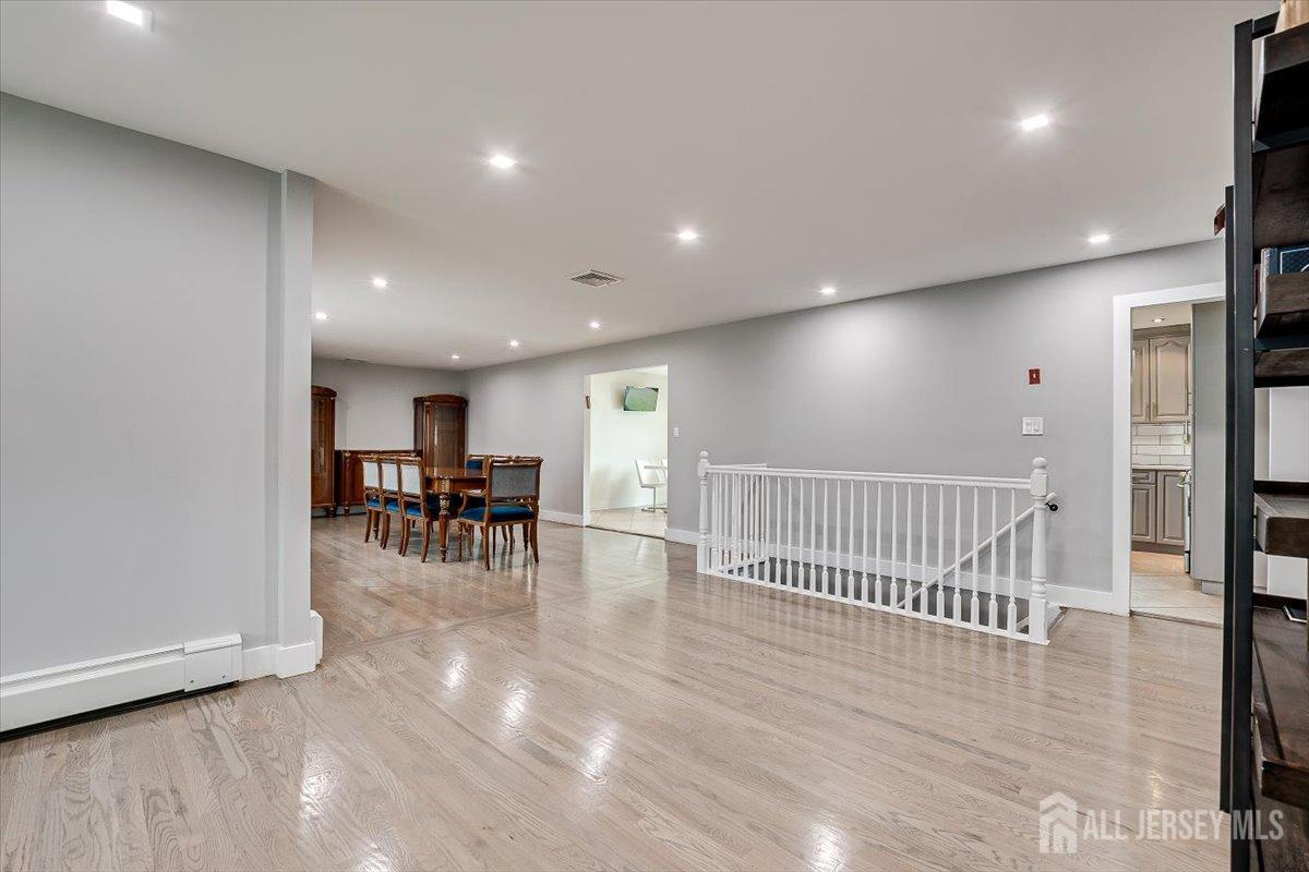 28 Clark Avenue Edison, NJ 08817 - Photo 14 of 47 a view of a an empty room with wooden floor