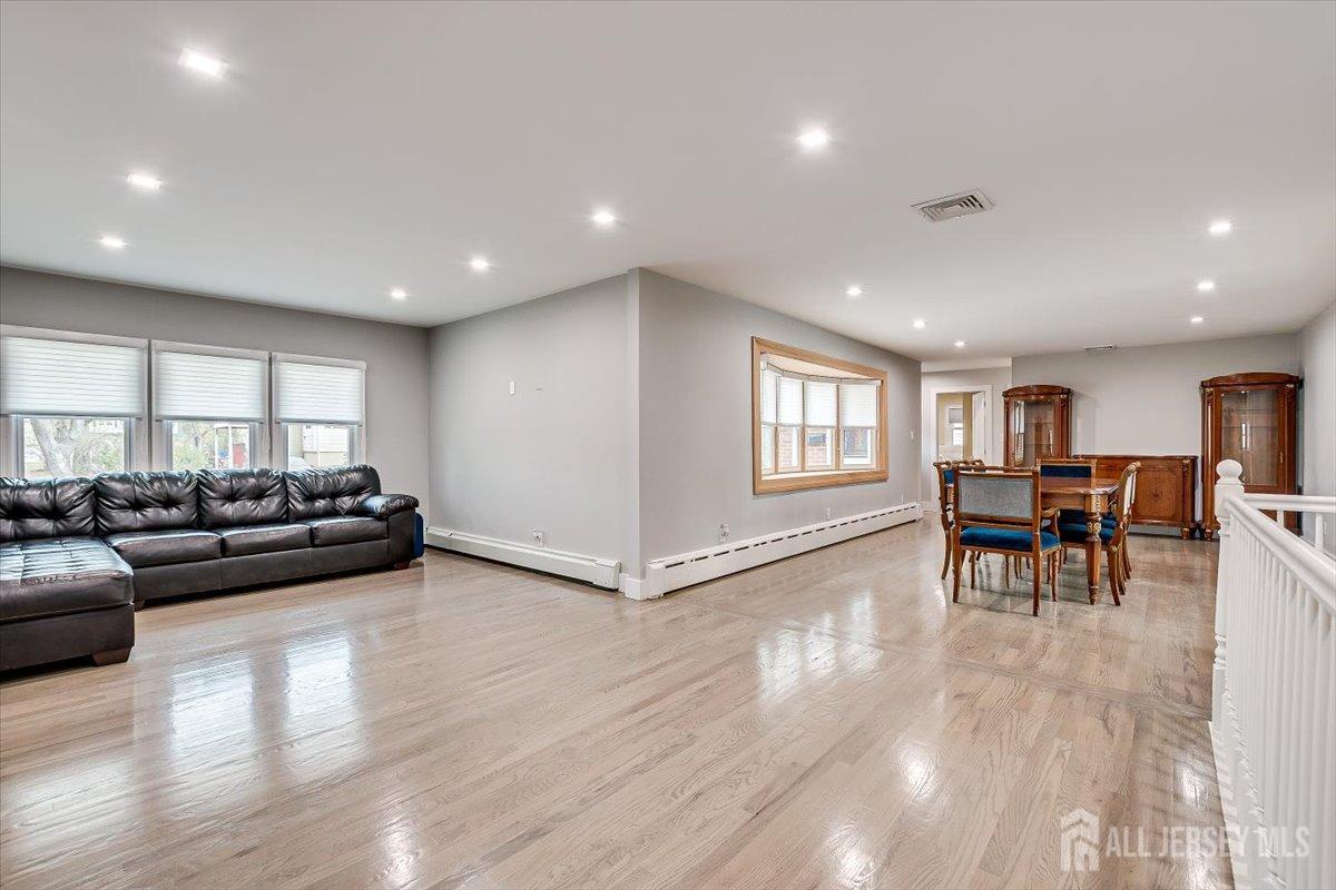 28 Clark Avenue Edison, NJ 08817 - Photo 15 of 47 a living room with furniture and a wooden floor