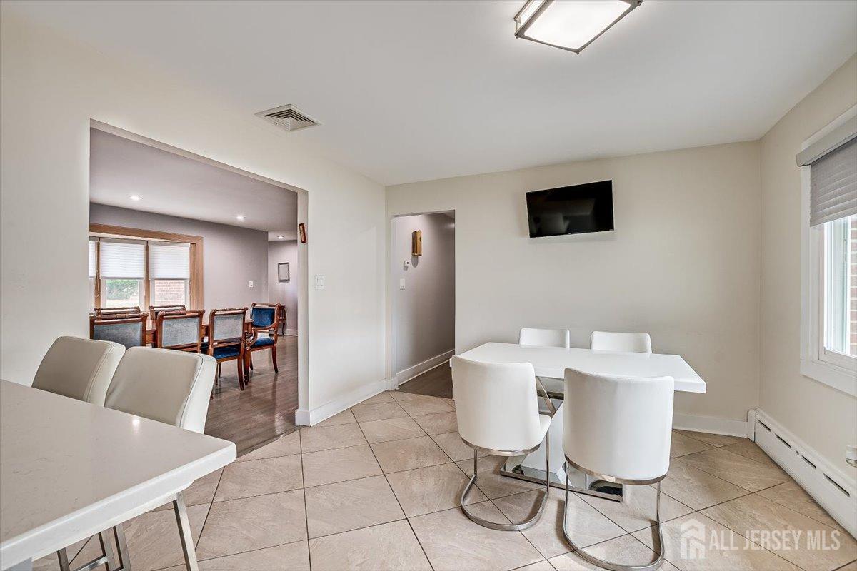 28 Clark Avenue Edison, NJ 08817 - Photo 17 of 47 a view of a dining room with furniture and wooden floor