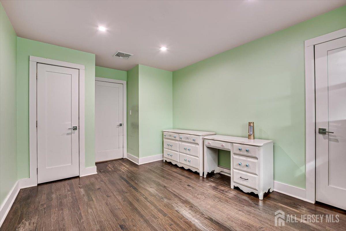 28 Clark Avenue Edison, NJ 08817 - Photo 30 of 47 a room with furniture and wooden floor