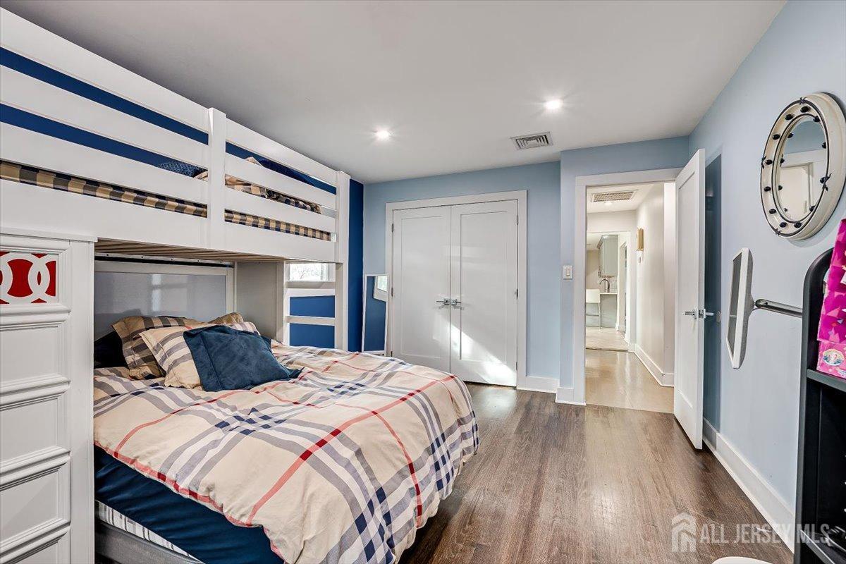 28 Clark Avenue Edison, NJ 08817 - Photo 32 of 47 a bedroom with a bed and a walk in closet