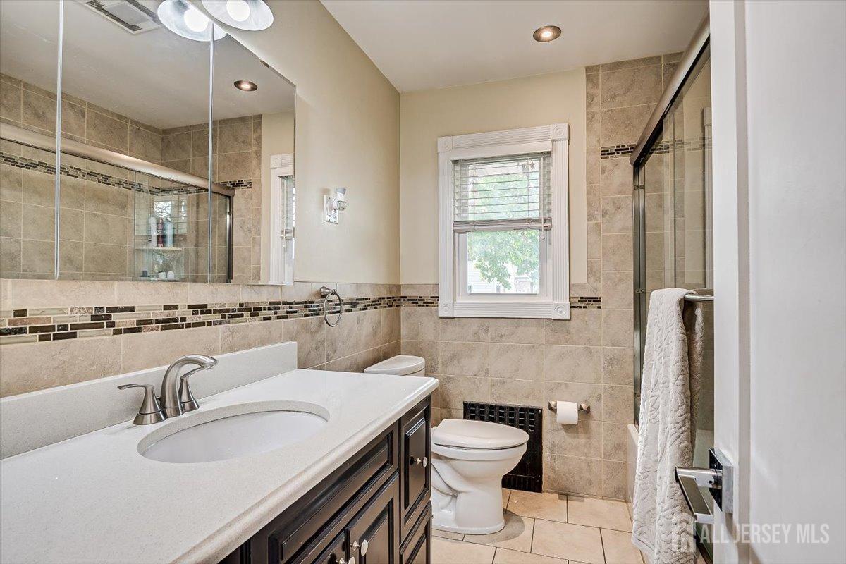 28 Clark Avenue Edison, NJ 08817 - Photo 33 of 47 a bathroom with a sink toilet and shower