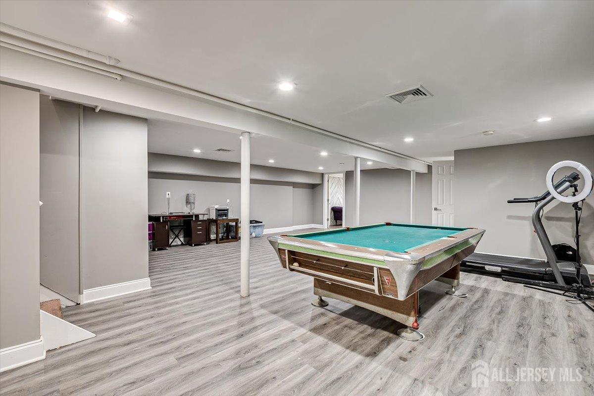 28 Clark Avenue Edison, NJ 08817 - Photo 36 of 47 a room with wooden furniture and pool table