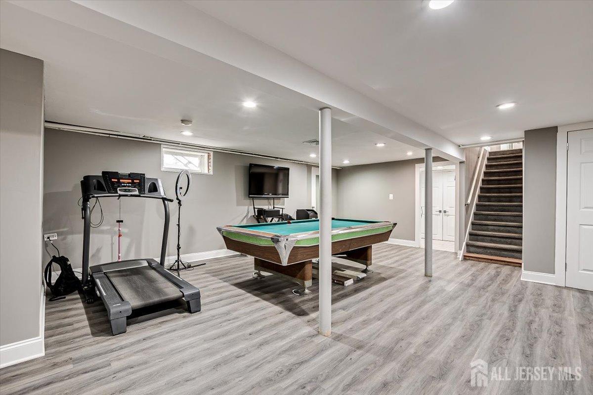 28 Clark Avenue Edison, NJ 08817 - Photo 38 of 47 a living room with furniture a wooden floor and a ceiling fan