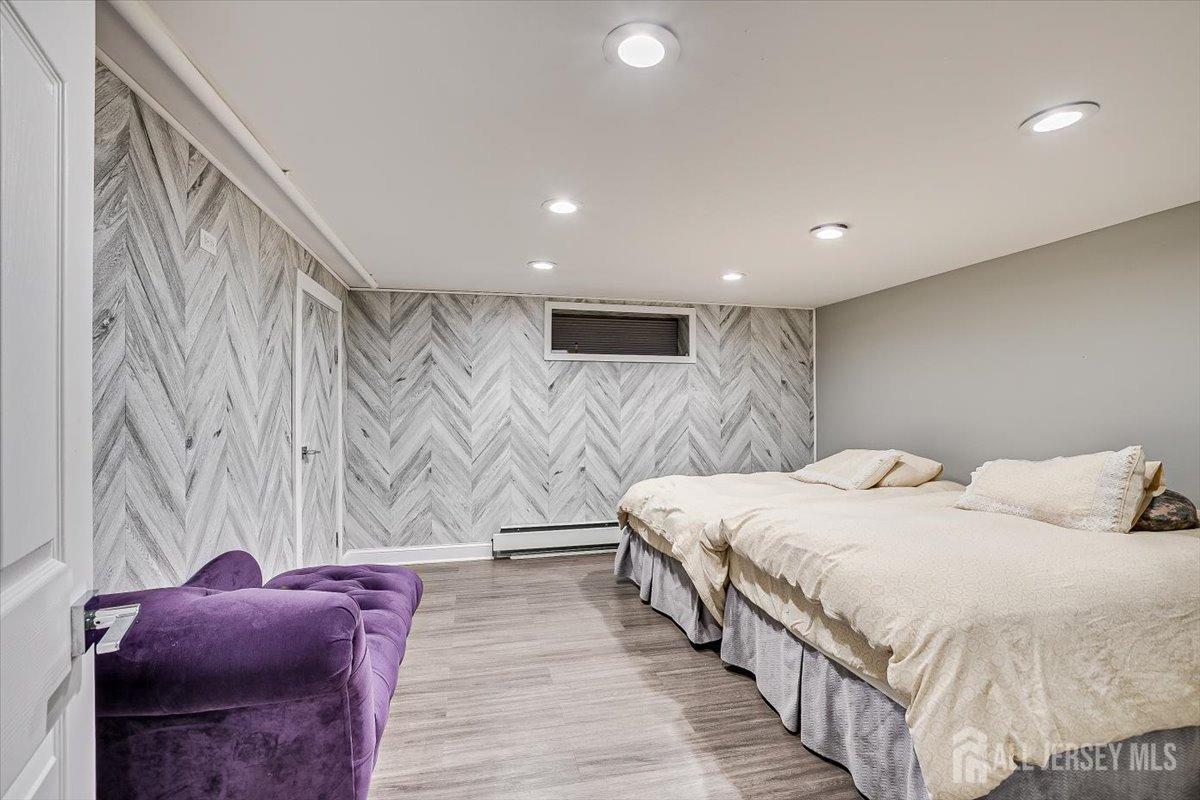 28 Clark Avenue Edison, NJ 08817 - Photo 39 of 47 a bedroom with a bed and a walk in closet