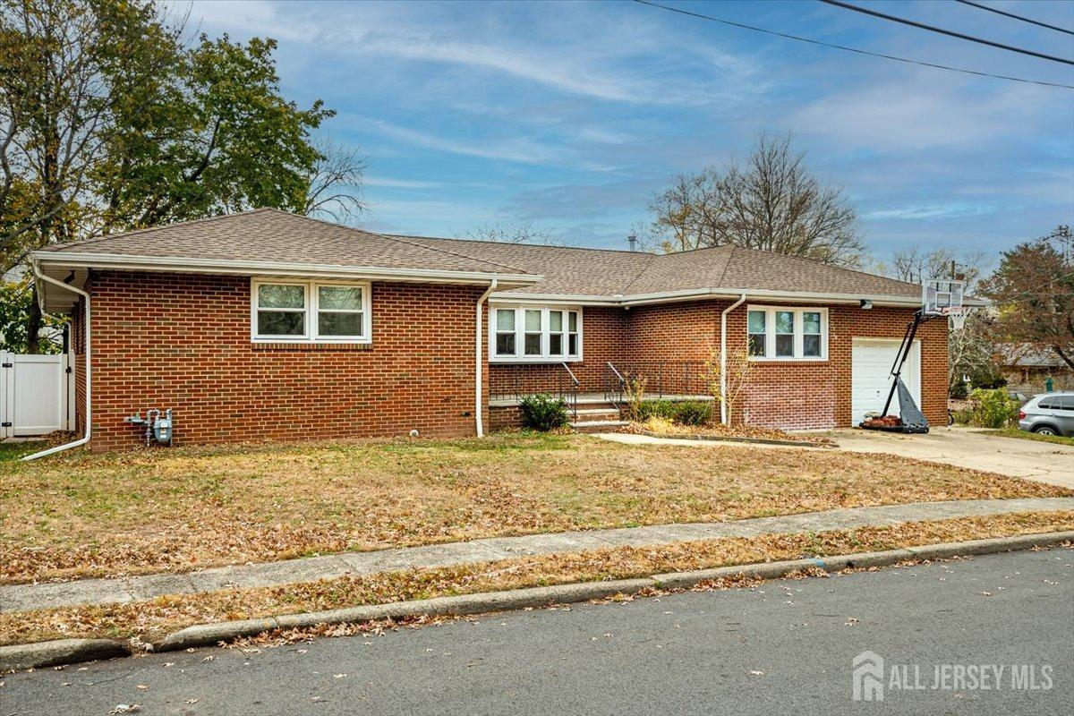 28 Clark Avenue Edison, NJ 08817 - Photo 4 of 47 a front view of a house with garden