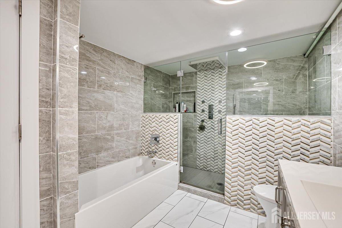 28 Clark Avenue Edison, NJ 08817 - Photo 42 of 47 a bathroom with a bathtub and shower