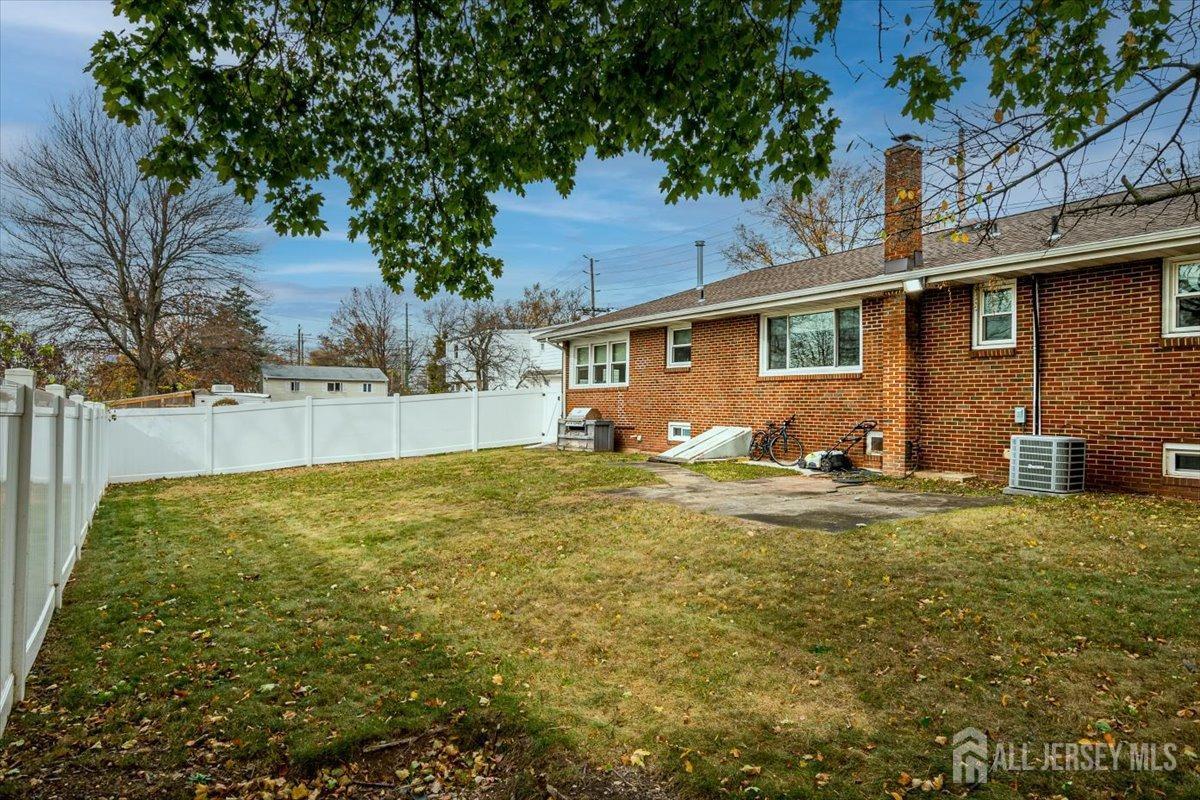 28 Clark Avenue Edison, NJ 08817 - Photo 46 of 47 a backyard of a house with table and chairs