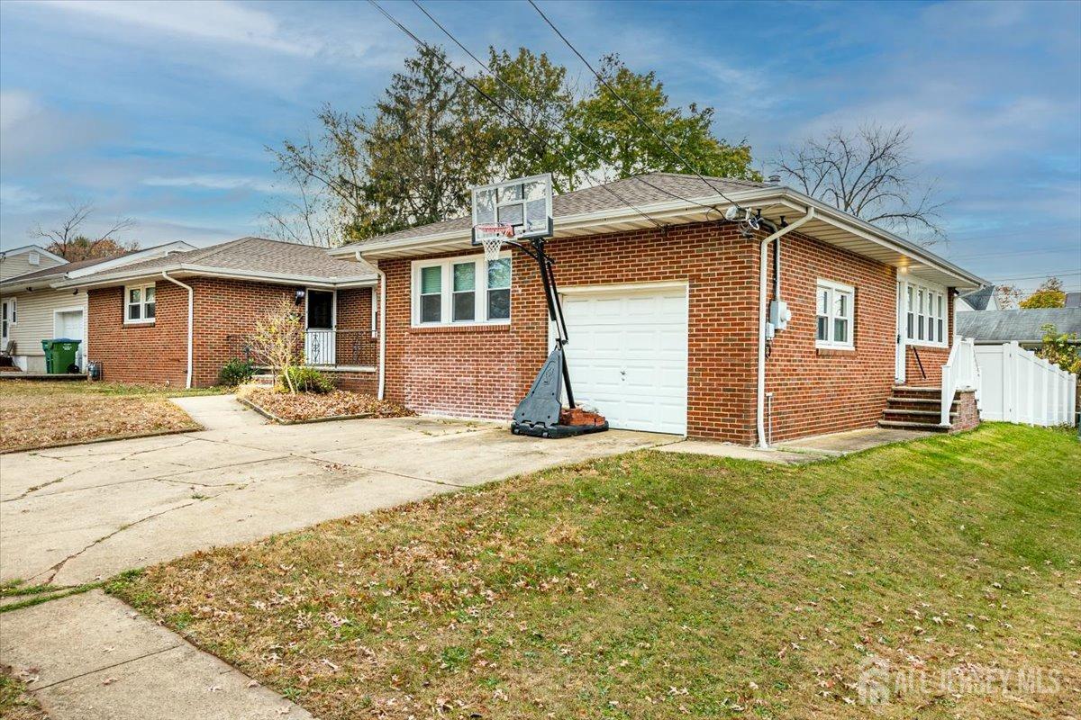 28 Clark Avenue Edison, NJ 08817 - Photo 5 of 47 a front view of a house with a yard