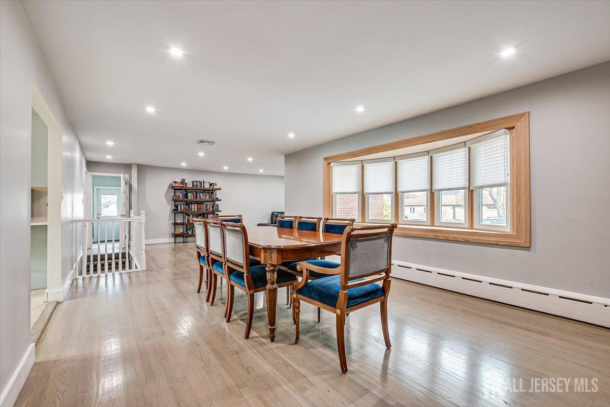 28 Clark Avenue Edison, NJ 08817 - Photo 9 of 47 a dining room with furniture and a floor to ceiling window