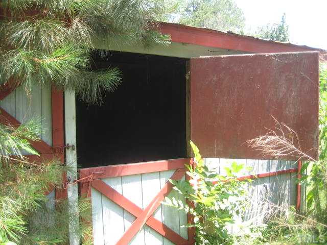 8621 Old Stage Road Raleigh, NC 27603 - Photo 12 of 25 2 stall horse barn, with tack room storage in fenced patures