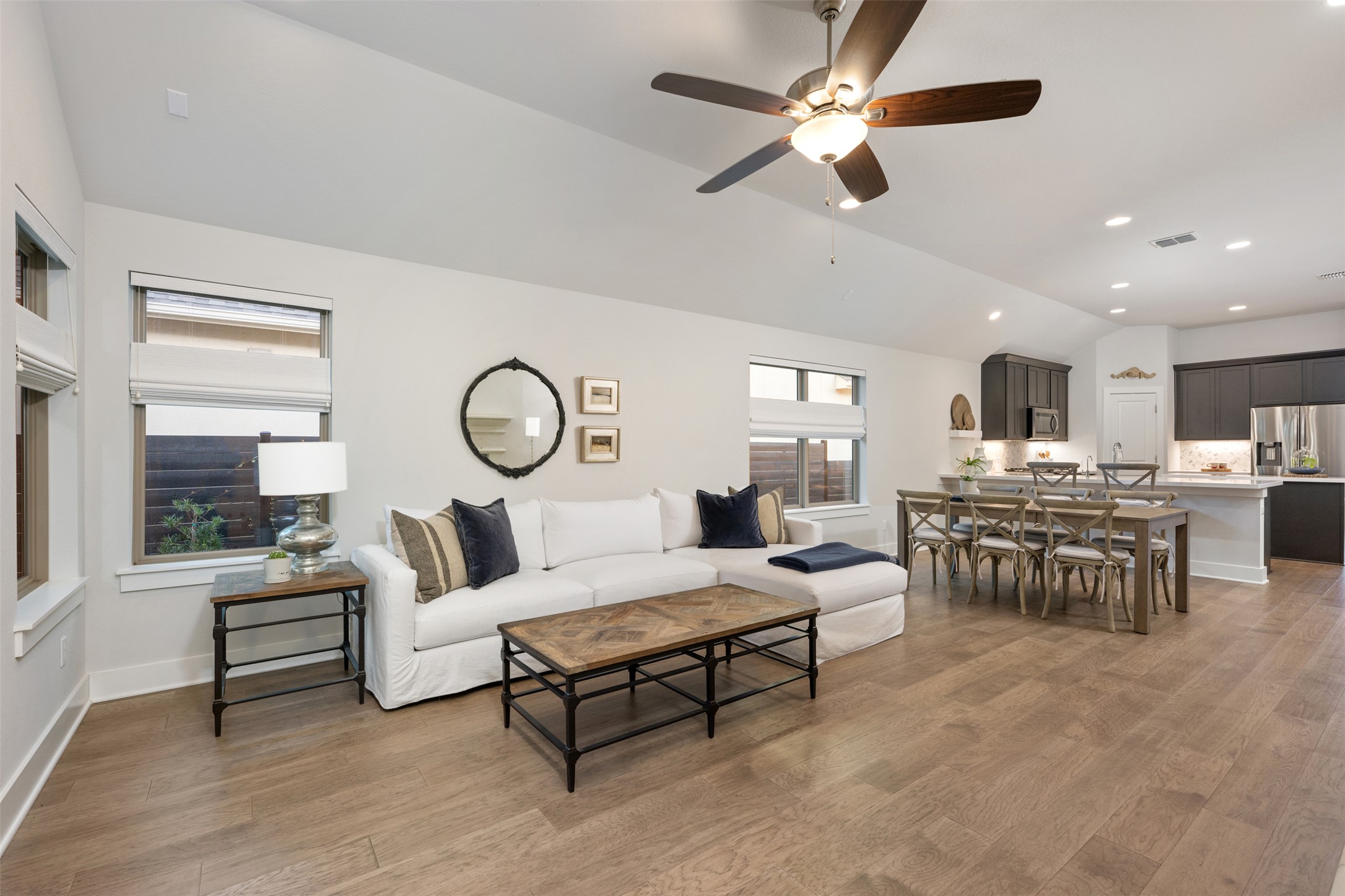 418 Raleigh Drive Georgetown, TX 78633 - Photo 11 of 39 a living room with furniture a chandelier fan and a large window