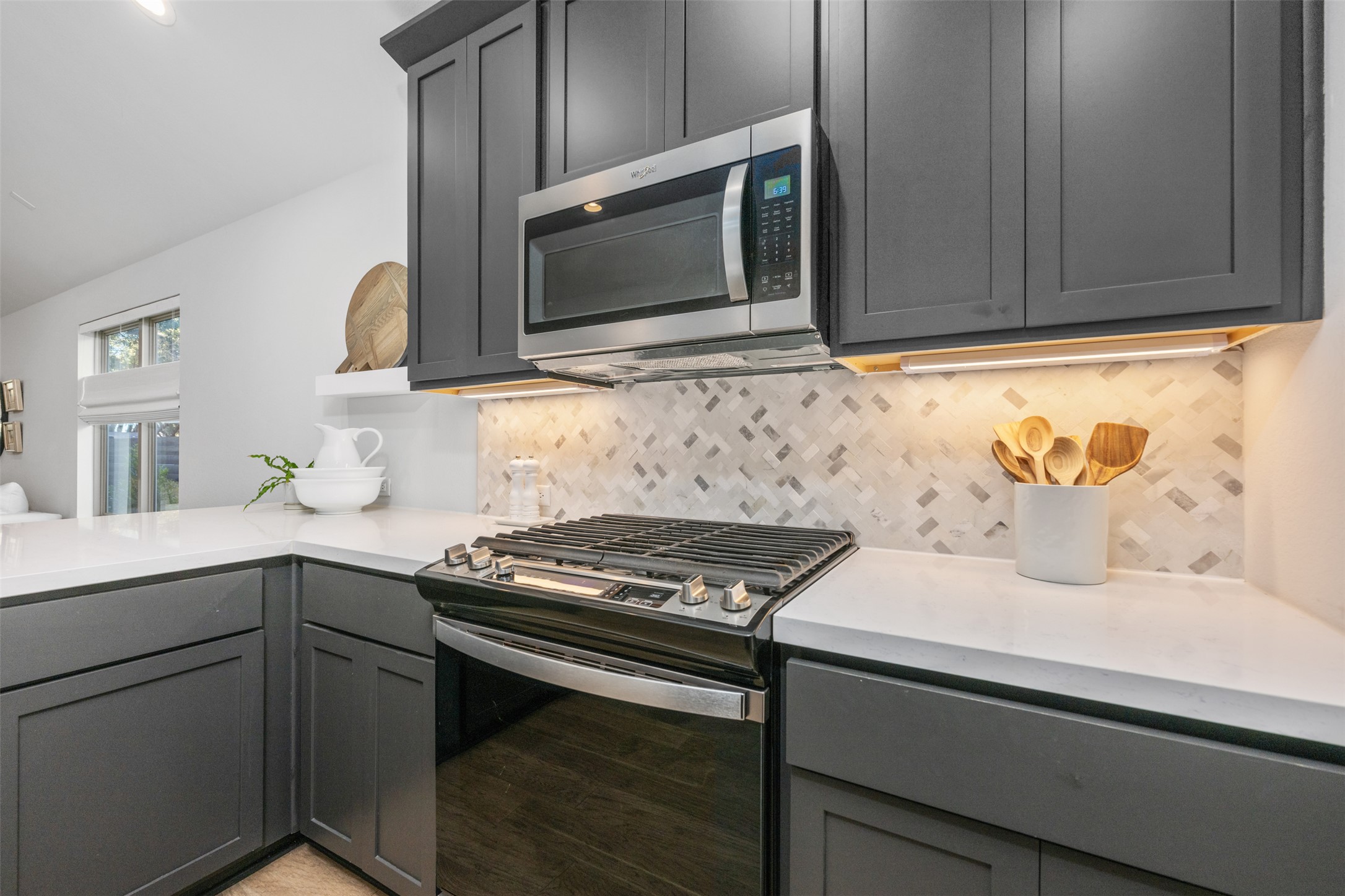 418 Raleigh Drive Georgetown, TX 78633 - Photo 14 of 39 a kitchen with stainless steel appliances white cabinets and a stove top oven