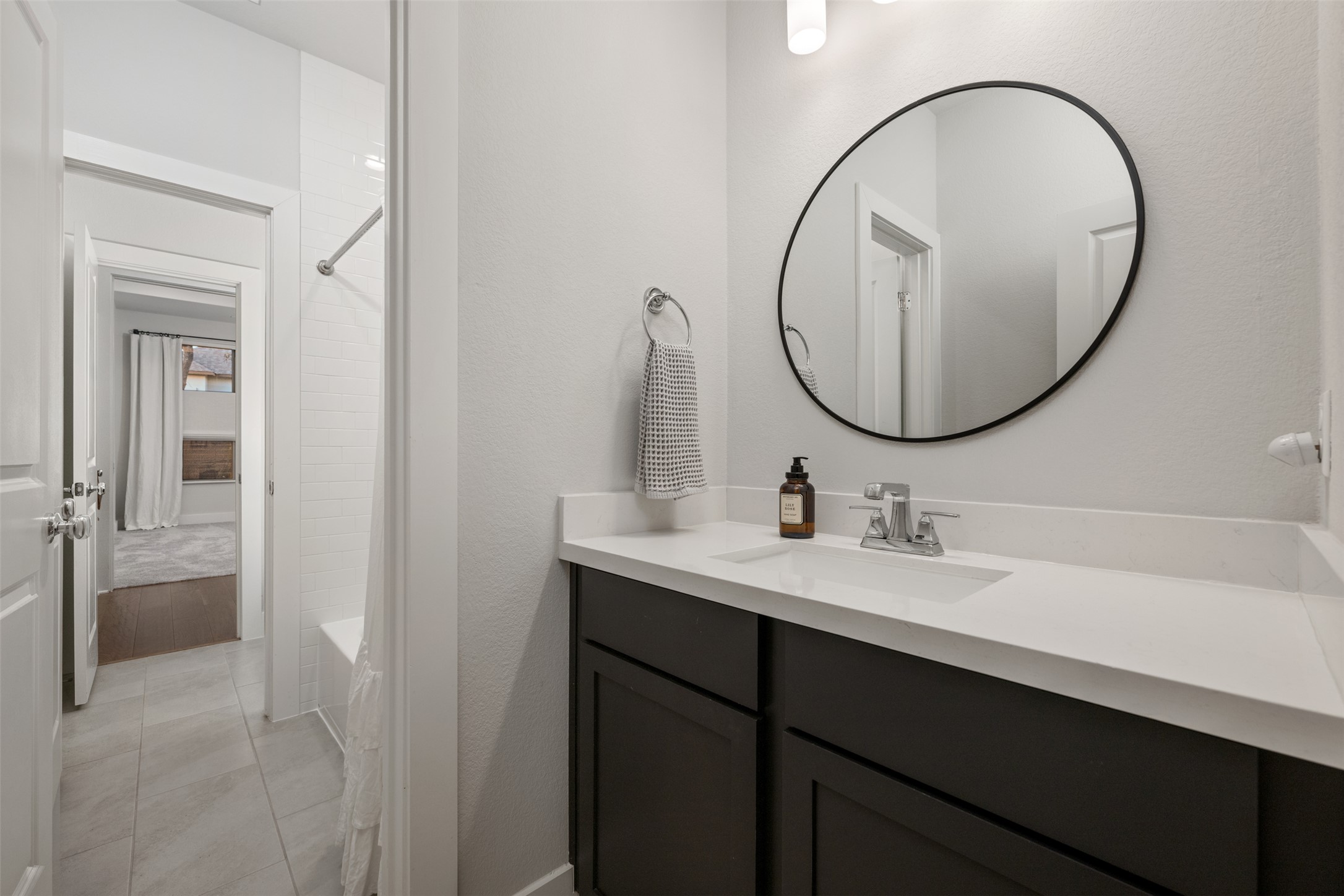 418 Raleigh Drive Georgetown, TX 78633 - Photo 31 of 39 a bathroom with a sink and a mirror
