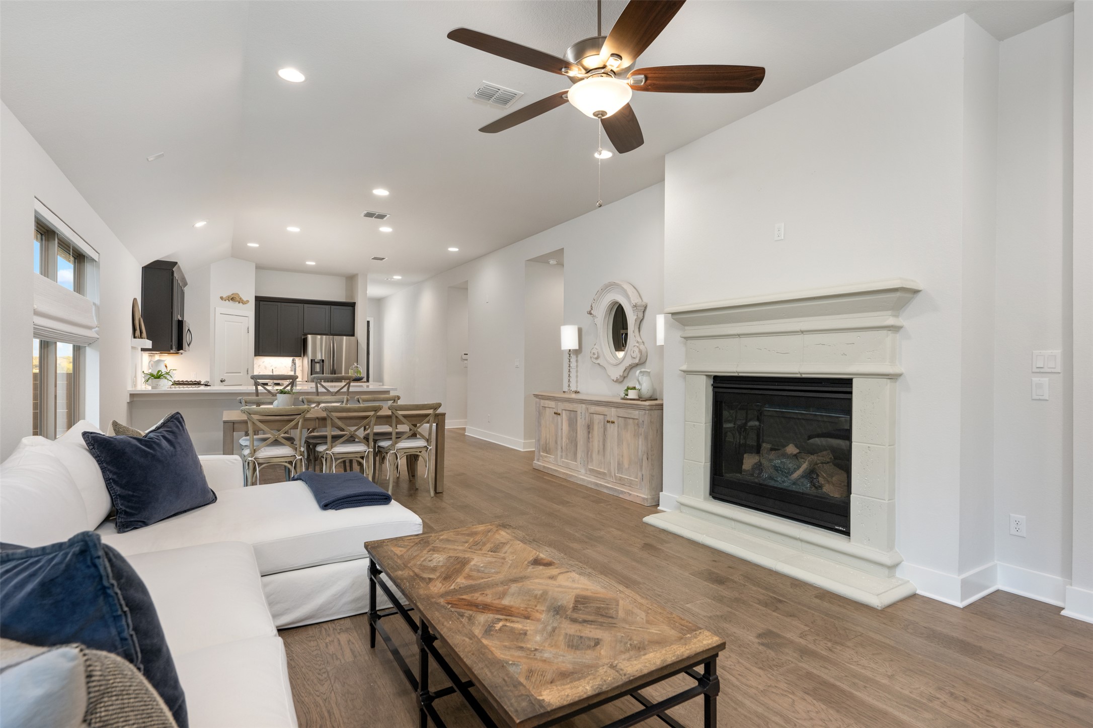 418 Raleigh Drive Georgetown, TX 78633 - Photo 10 of 39 a living room with furniture a fireplace and a ceiling fan