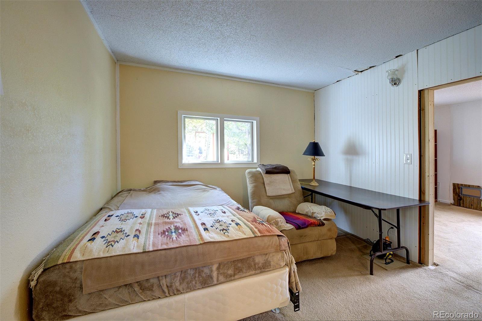117 Tall Timber Lane Bailey, CO 80421 - Photo 11 of 37 a bedroom with a bed and cabinets