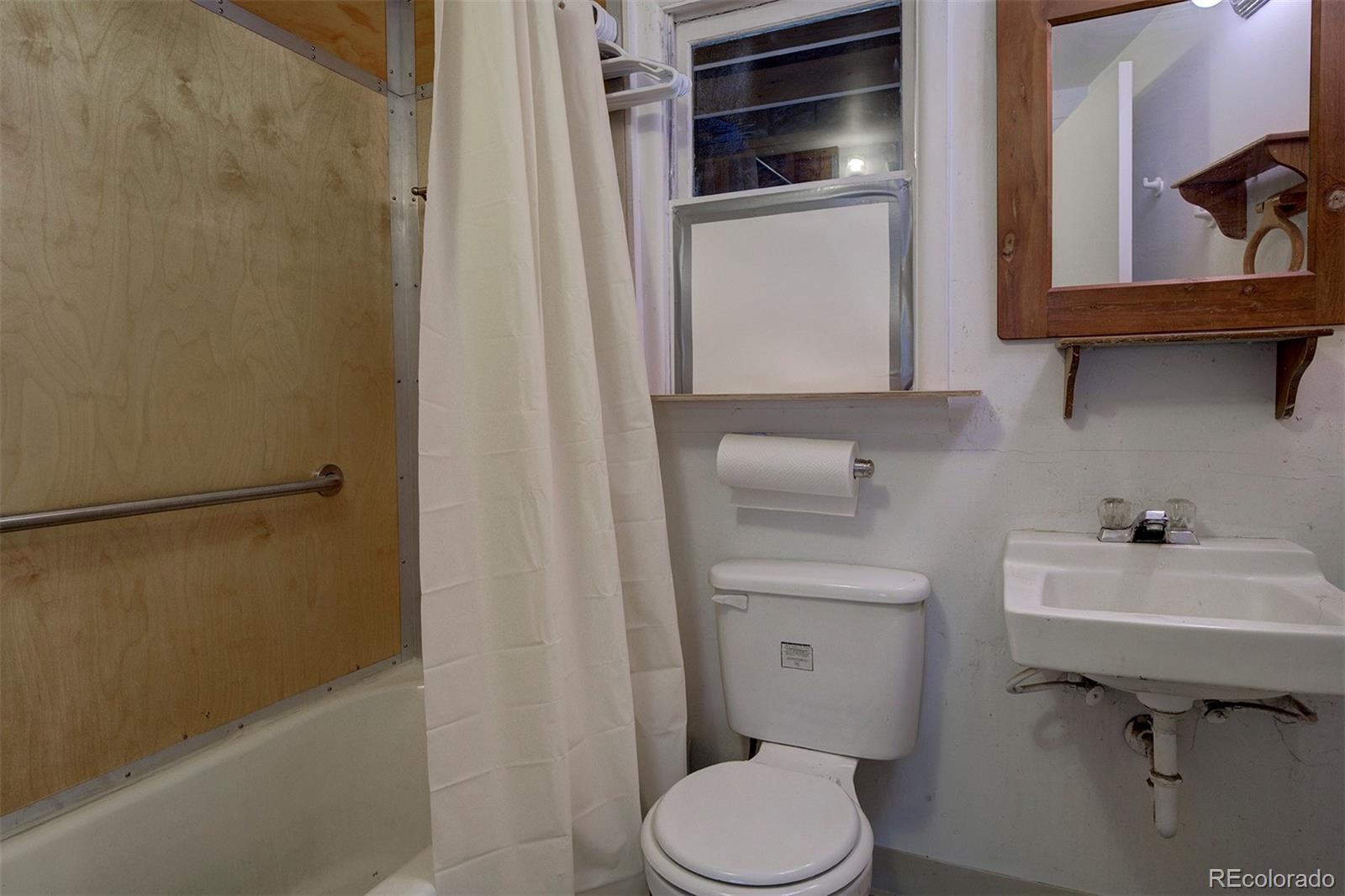 117 Tall Timber Lane Bailey, CO 80421 - Photo 12 of 37 a bathroom with a sink toilet and shower