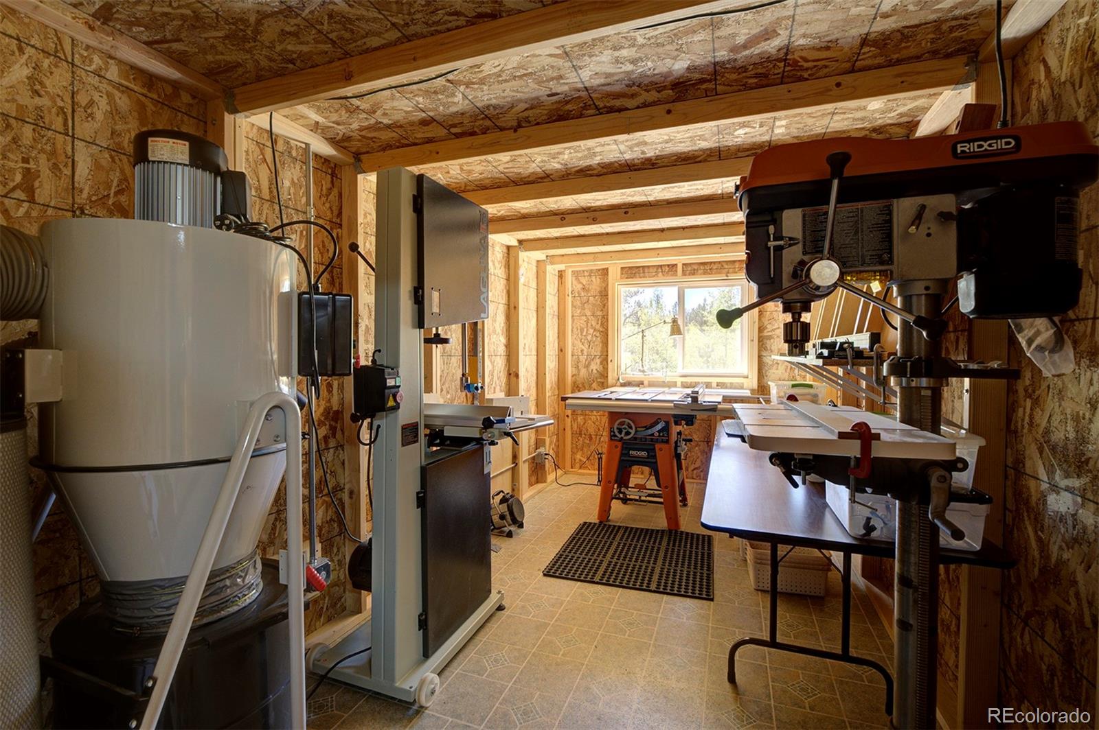 117 Tall Timber Lane Bailey, CO 80421 - Photo 30 of 37 a view of a dining room with furniture window and outside view