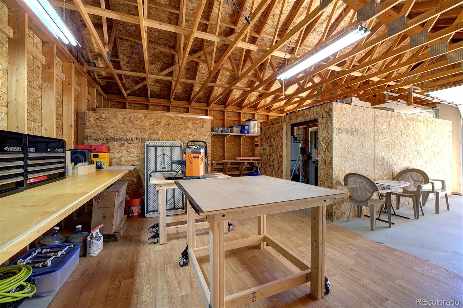 117 Tall Timber Lane Bailey, CO 80421 - Photo 31 of 37 a view of a kitchen with furniture and wooden floor