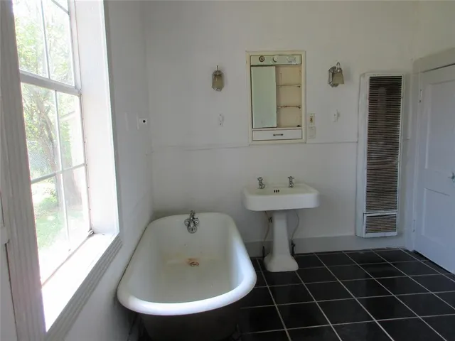 a bathroom with a sink and a bathtub