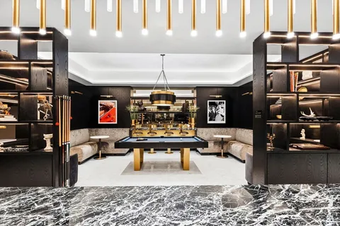 a kitchen with stainless steel appliances kitchen island granite countertop a stove and a sink