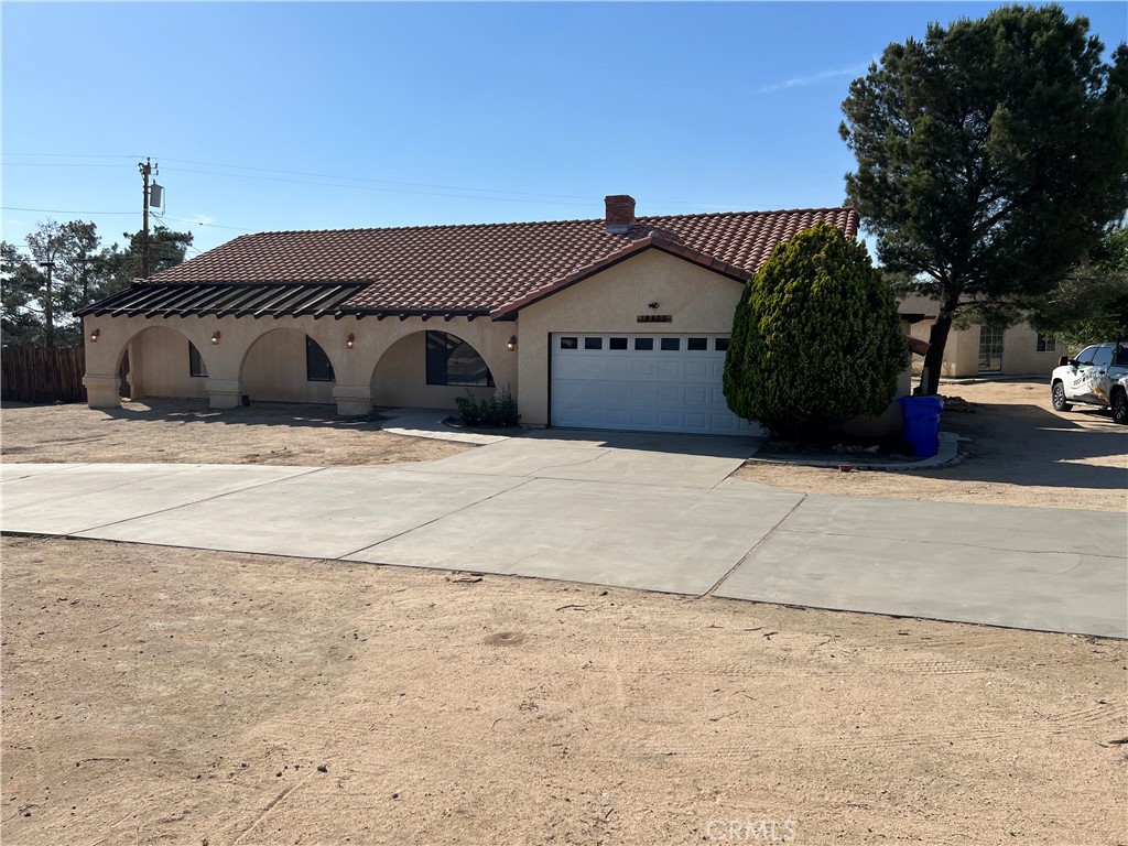 18820 Otomian Road Apple Valley, CA 92307 - Photo 1 of 1 a front view of a house with a yard