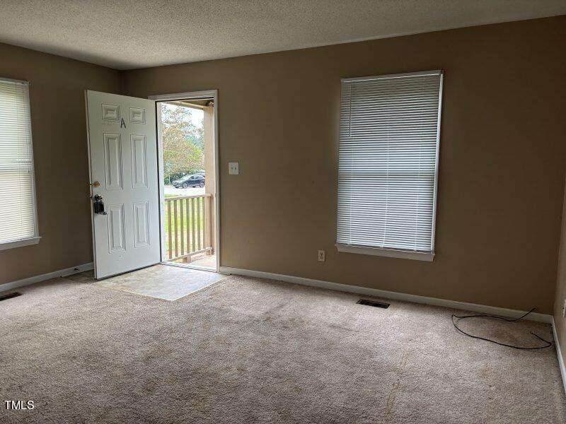 4724 Hoyle Drive Raleigh, NC 27604 - Photo 3 of 11 an empty room with windows