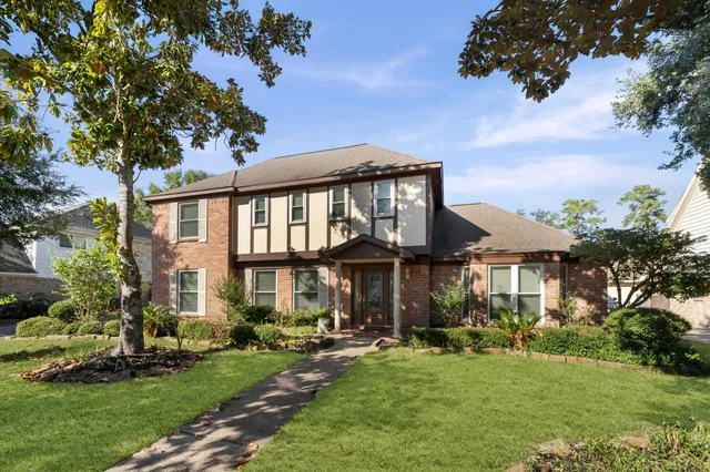 a front view of a house with a yard table and chairs