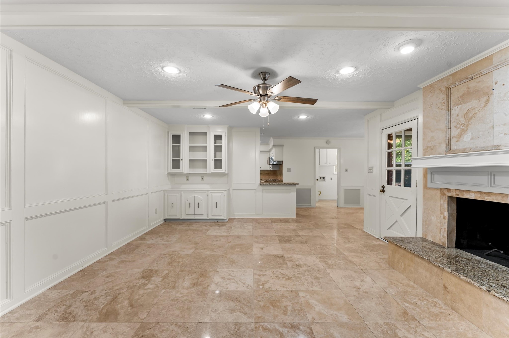 7311 17th Green Drive Humble, TX 77346 - Photo 13 of 32 a view of a livingroom with a fireplace and a chandelier fan
