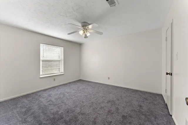 a view of empty room with fan