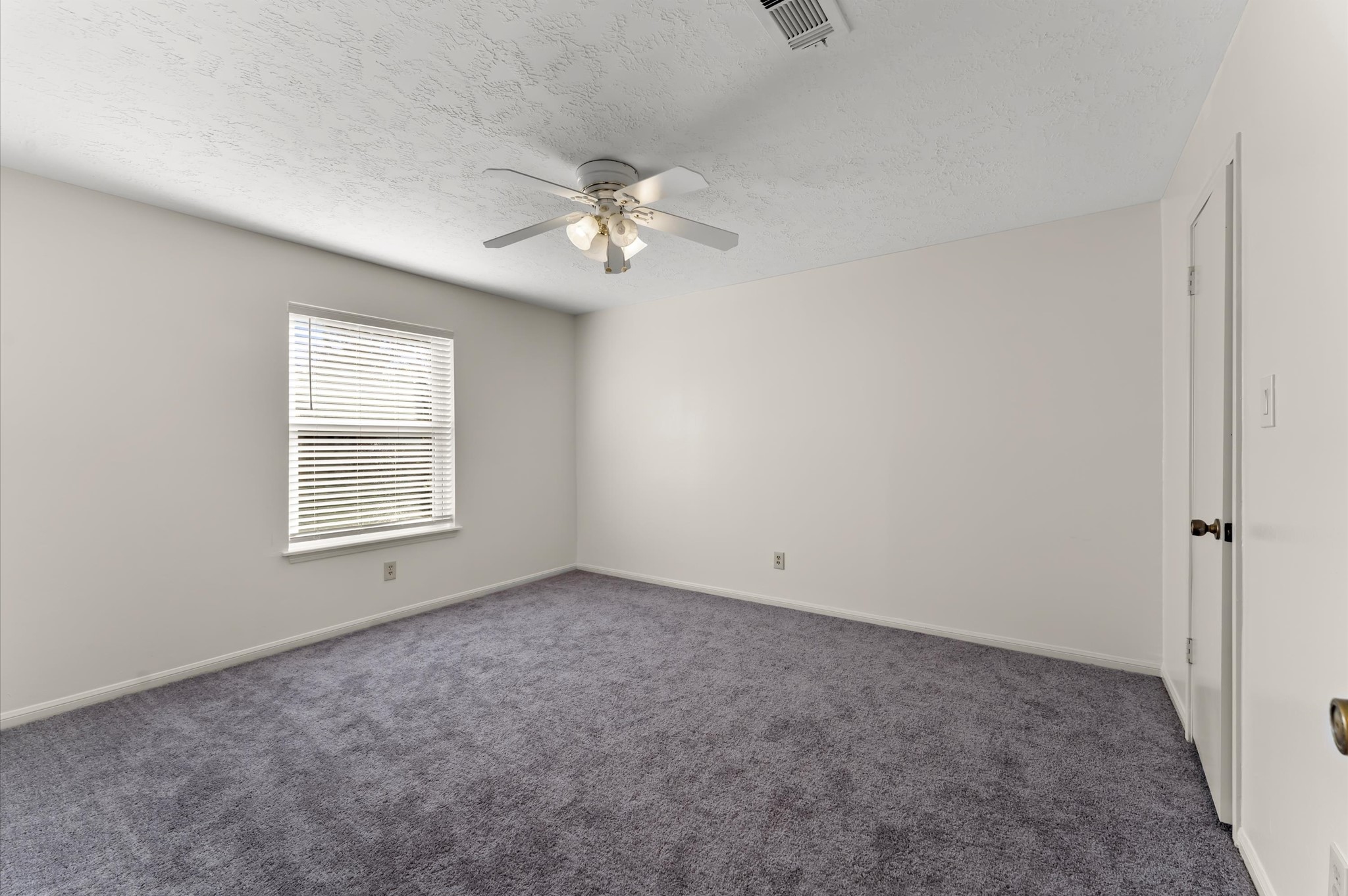 7311 17th Green Drive Humble, TX 77346 - Photo 25 of 32 a view of empty room with fan
