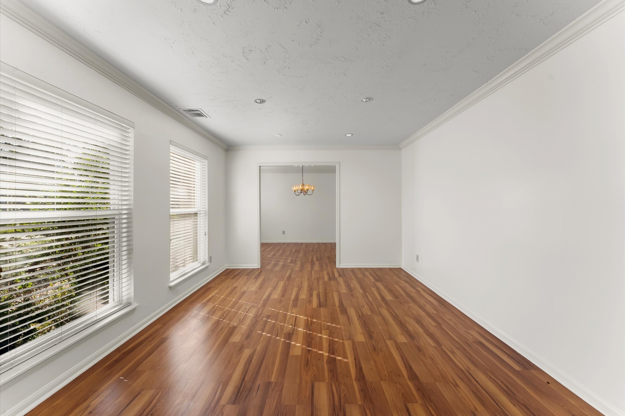 7311 17th Green Drive Humble, TX 77346 - Photo 5 of 32 a view of wooden floor in an empty room