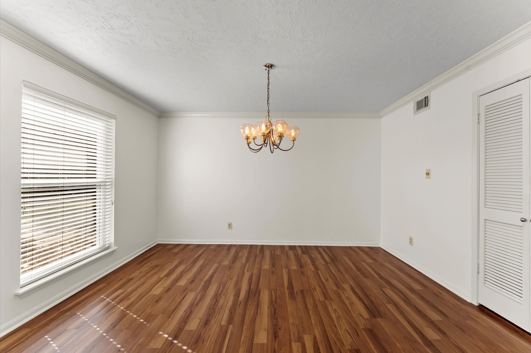 7311 17th Green Drive Humble, TX 77346 - Photo 6 of 32 a view of empty room with wooden floor and fan