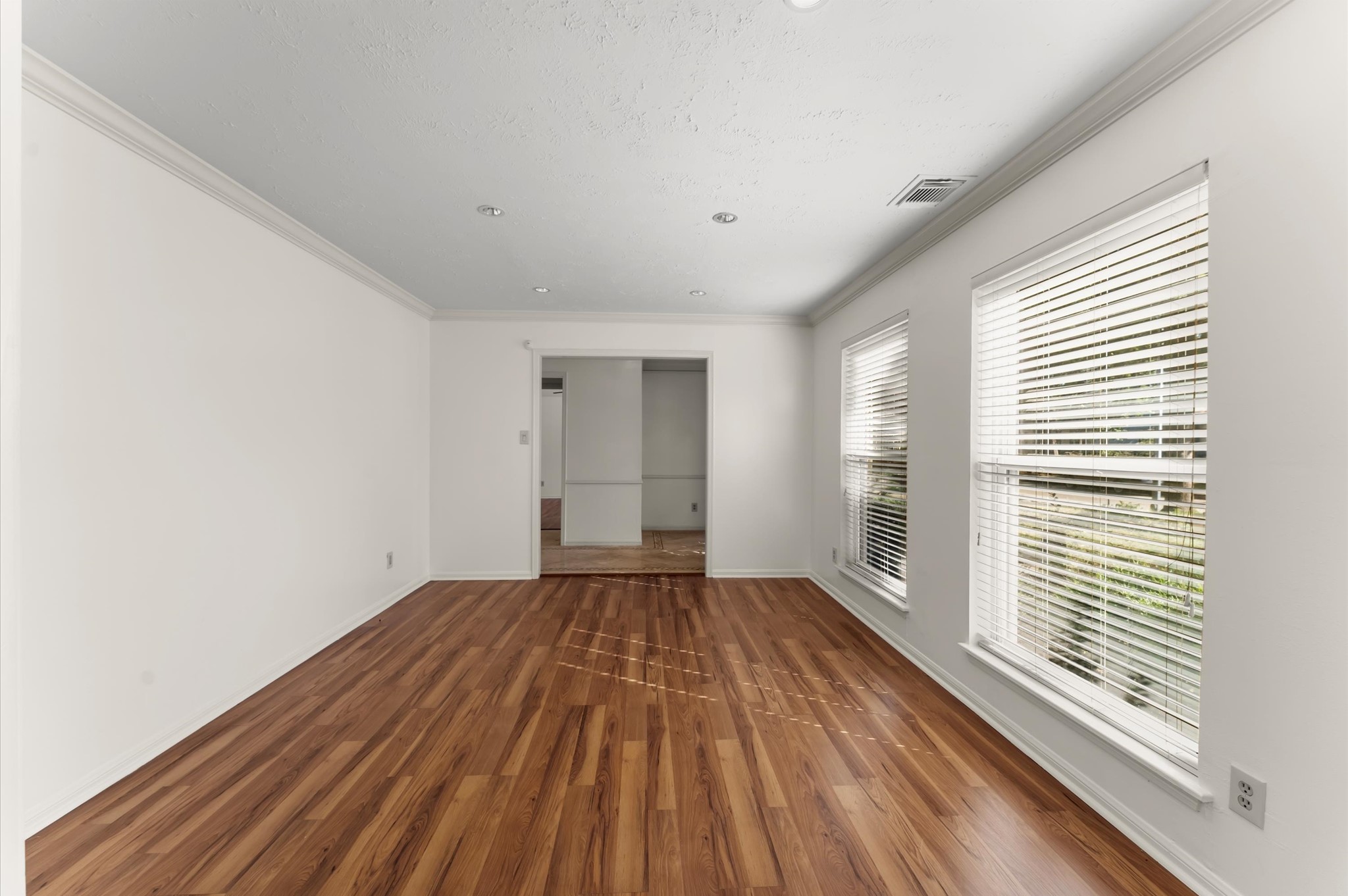 7311 17th Green Drive Humble, TX 77346 - Photo 7 of 32 a view of a room with wooden floor and window