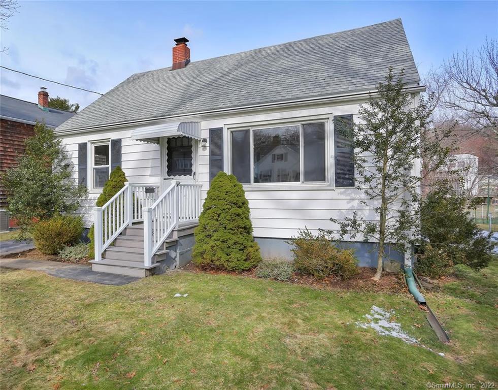 1658 Stratfield Road Fairfield, CT 06825 - Photo 1 of 1 a front view of a house with a yard