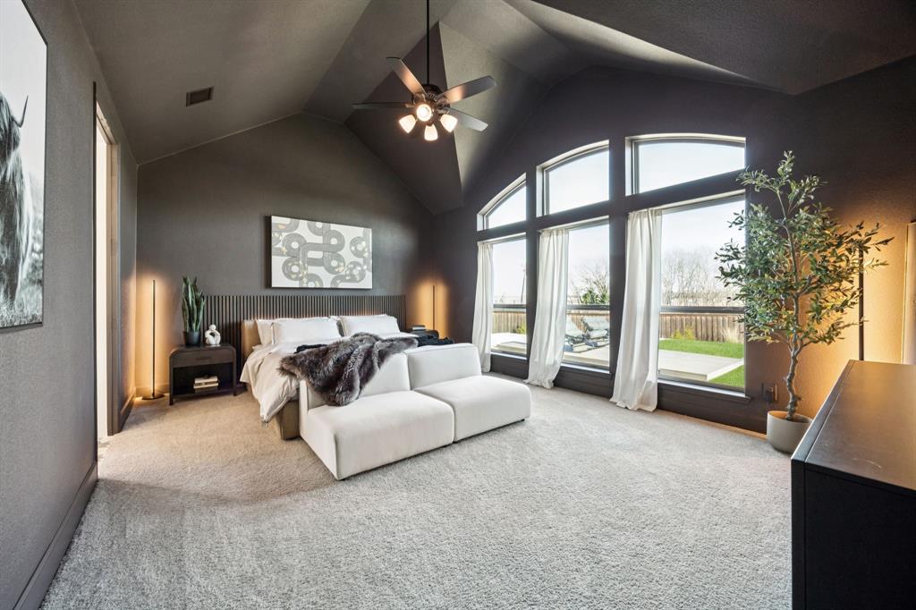 1551 Ripasso Way McLendon-Chisholm, TX 75032 - Photo 13 of 39 a bed room with a bed and a chandelier