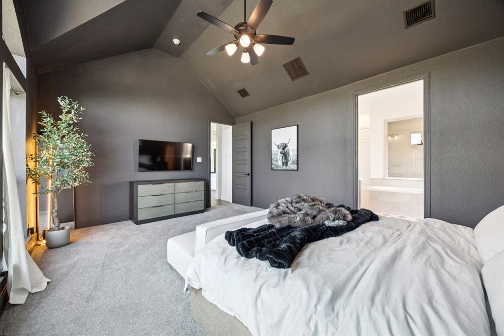 1551 Ripasso Way McLendon-Chisholm, TX 75032 - Photo 15 of 39 a bedroom with a bed and a flat screen tv