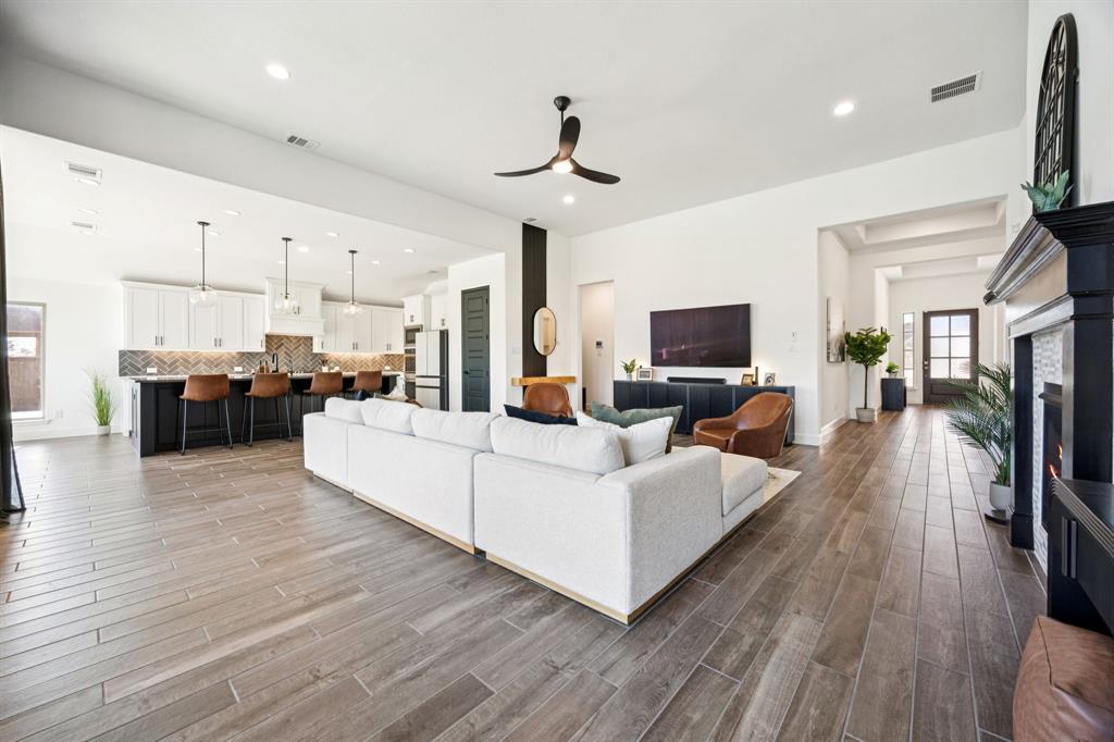 1551 Ripasso Way McLendon-Chisholm, TX 75032 - Photo 18 of 39 a living room with furniture and a flat screen tv