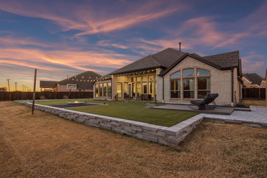 1551 Ripasso Way McLendon-Chisholm, TX 75032 - Photo 2 of 39 a view of a house with a big yard and large tree